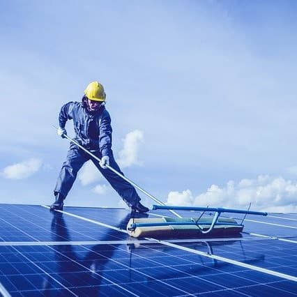 Solar panel installer at work